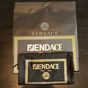 FENDACE box, dust bag, and Versace bag.